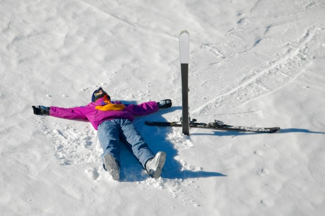 Alpine skier laying on the slope