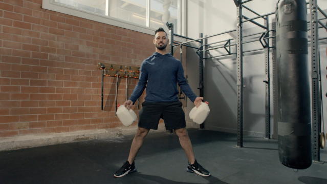 Milk athlete Ariel demonstrates a strength workout using milk gallons.