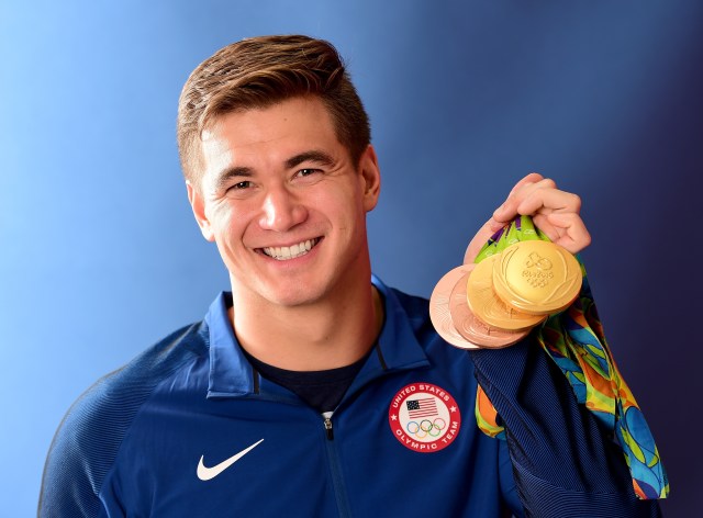Nathan Adrian poses with medals.