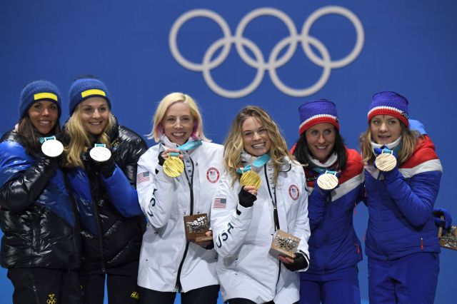 USA's gold medallists Kikkan Randall and Jessica Diggins stand on the podium at the Pyeongchang Olympics