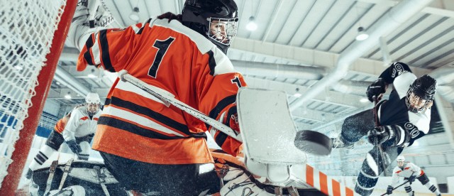 Hockey player scoring a goal