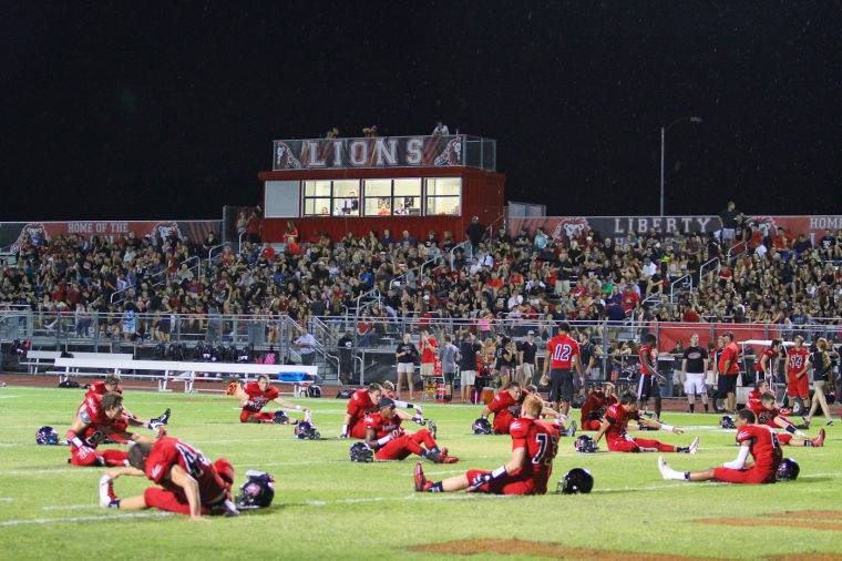 Liberty Lions football stretching