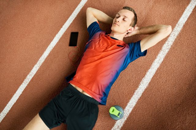 Man laying down on track