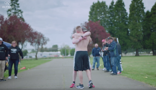 Two Runners Hug After A Marathon