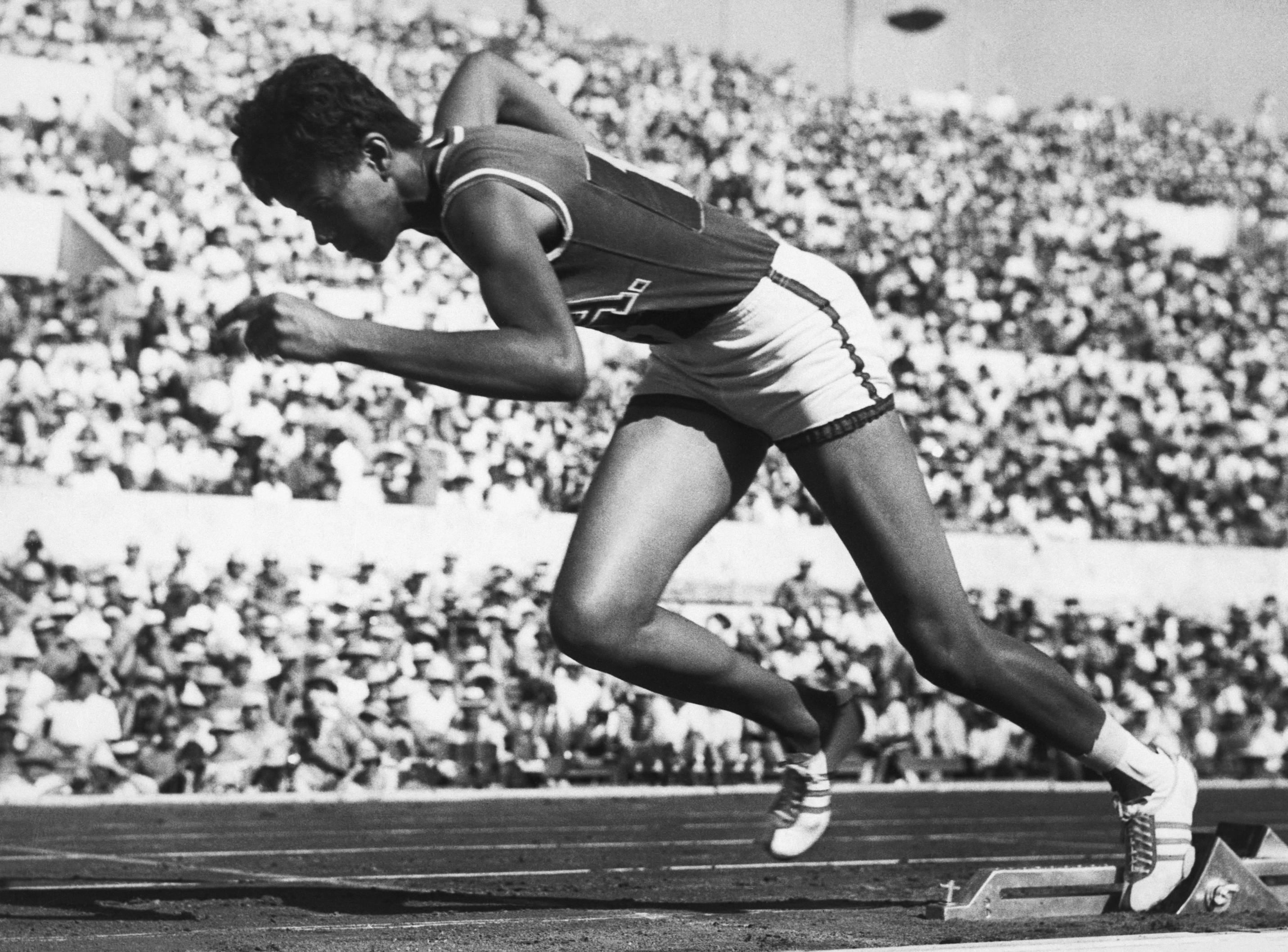 Wilma Rudolph Sprinting from Starting Blocks