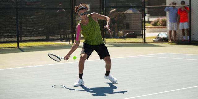 male playing tennis