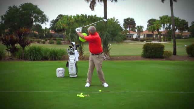 Martin Hall demonstrates full swing on golf course