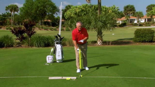 Martin Hall teaches setting up to the ball on a golf course