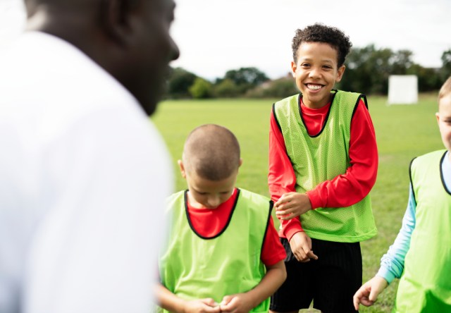 Football coach training his students