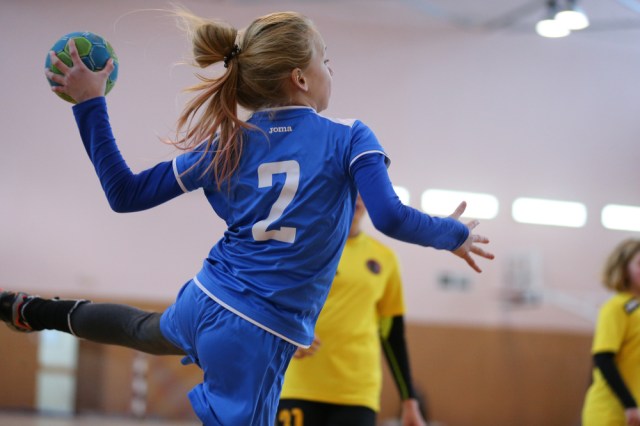 Young girls playing indoor handball