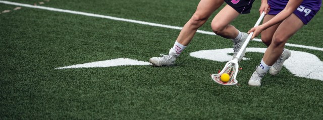 women's lacrosse player on the field