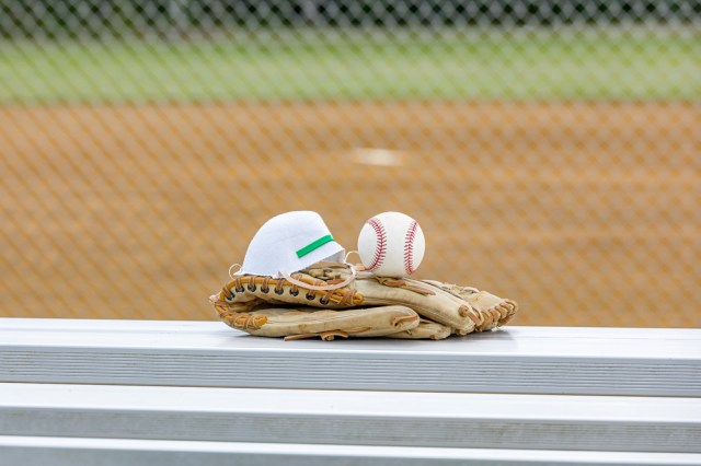 Baseball glove, ball and N95 respirator mask at baseball field