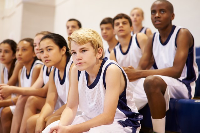 Athletes watching a basketball game