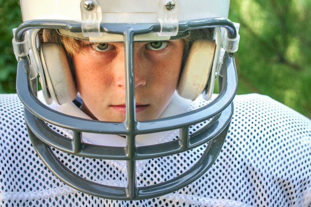 young boy in football uniform
