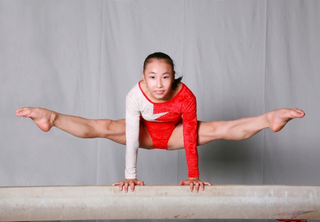 young gymnast Girl on Balance beam