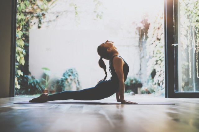 young woman practicing yoga indoor