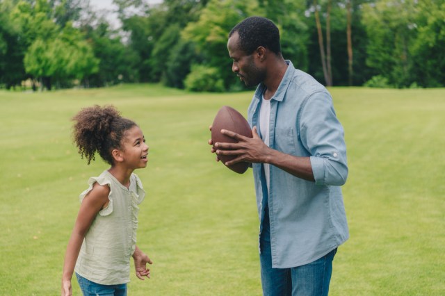 man and little daughter having conversation