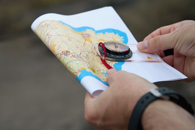 Map and compass for orienteering article.