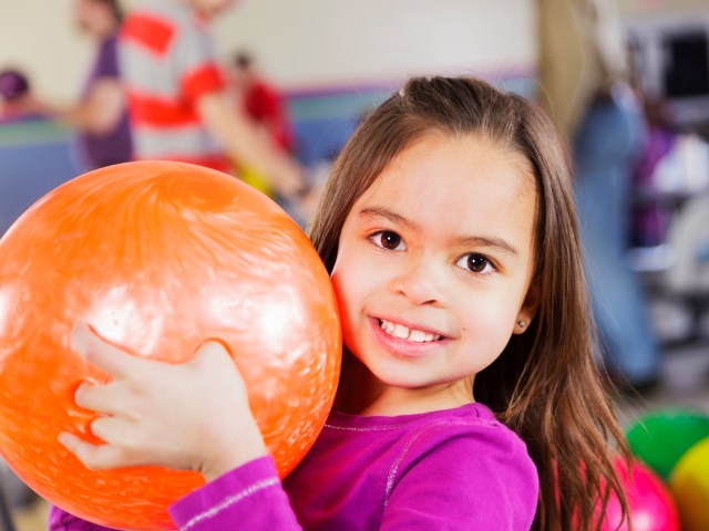 young girl with bowling ball