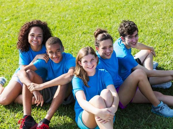 kids sitting on grass