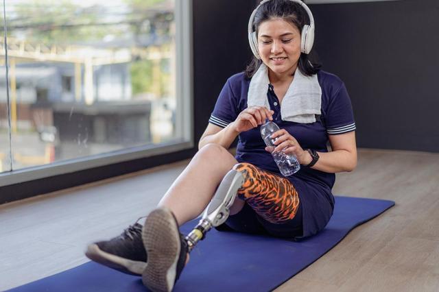 Woman smiling doing yoga.
