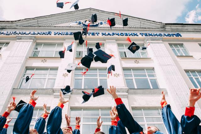 Graduation hats in the air