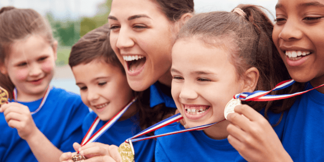 Young athletes with gold medals