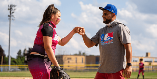 Coach and athlete fist bump