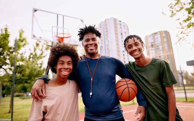 Teens with basketball coach